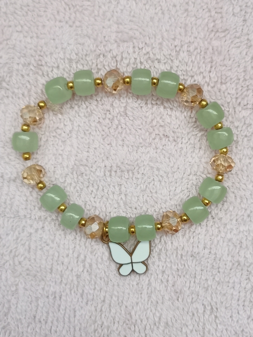 NWOT.Mint Bead Bracelet with Butterfly Charm